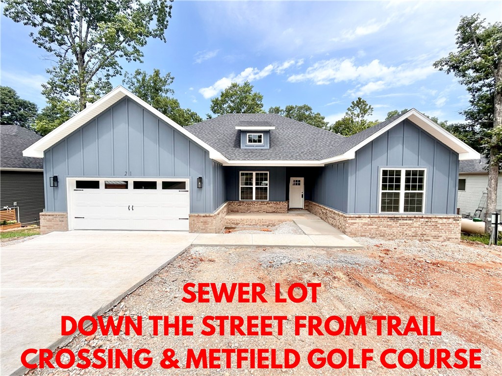 Stunning new construction home on a wooded cul-de-sac sewer lot! Perfectly situated down the street from the Rago Trail Crossing, Lake Brittany, and Metfield Golf Course! Provides easy access to Blowing Springs Park and only 15 minutes to downtown Bentonville. Step inside to discover a beautifully designed interior with a split floor plan, gorgeous wood floors & modern custom finishes throughout. The spacious living area showcases a beamed vaulted ceiling, creating an inviting atmosphere. The kitchen features sleek 3 cm quartz countertops, a gas range, custom cabinets, and stylish stainless-steel appliances. Retreat to the luxurious primary bath, which boasts a huge walk-in closet, a large custom walk-in tile shower, and a soaking tub. 2 covered patios. Bentonville schools! As an added bonus, receive $3,500 towards buyer's closing costs when working with the builder’s preferred local lender!