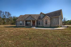 Gorgeous custom home in Cloverleaf Estates! This gem features a large open concept for today's modern family, custom kitchen with a 36'' gas range and separate wall oven & built in microwave. Master Suite is complete with both his/her closets and his/her vanities. Relax in the oversized tile shower with a soothing pebbled floor! Split floor plan for added privacy. 2 guestrooms on the main level share a jack & jill bath and near the front entrance you'll find a separate office/ playroom or a relaxing place for guests! Seller is also offering a $10,000 allowance towards a trim/paint package due to the current transition from a rustic style to a more contemporary style! Follow the cedar staircase to the 2nd level where you'll find a complete private suite featuring