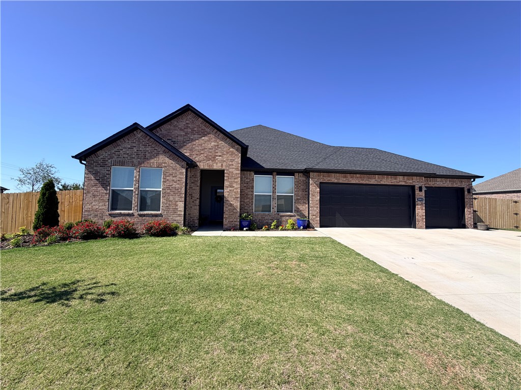 Welcome to luxury living in the desirable Hillcrest subdivision of Siloam Springs! This gorgeous home offers a heated and cooled 3-car garage complete with durable epoxy flooring and a thoughtfully designed floor plan perfect for modern living. Meticulously crafted with quality finishes throughout, this home combines style, comfort, and functionality. The spacious primary suite features a ceiling fan and a stunning en suite bath with an oversized walk-in tiled shower, elongated commode, and elegant quartz countertops. The beautifully designed kitchen showcases quartz countertops, tile backsplash, 42-inch upper cabinets, and sleek black plumbing fixtures for a sophisticated modern touch. Enjoy LED lighting throughout the home, along with a welcoming living room featuring a ceiling fan and a stylish electric fireplace accented by a gorgeous poplar mantle. This exceptional home offers the perfect blend of luxury finishes and everyday comfort in one of Siloam Springs’ premier neighborhoods!