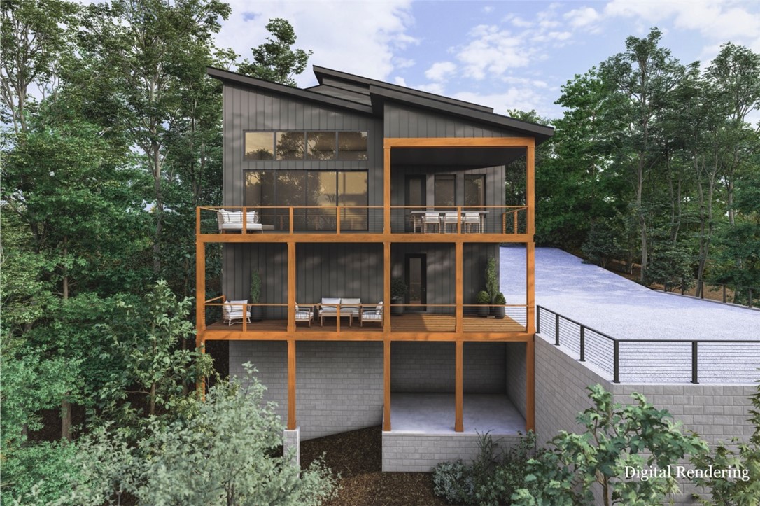 Welcome to trailside living at its finest! Set along the Tunnel Vision trail, this architecturally striking new construction blends seamlessly into its natural surroundings. An elevated living experience across 3 levels is enhanced with an elevator. Expansive Pella windows and 14’ ceilings in the great room and 10' ceilings on the main level create a light-filled interior. The primary suite features a luxury 67” freestanding tub showcased at the 2025 International Builders’ Show, heated floors, custom closet, and curated finishes. Each bedroom offers a private ensuite, with additional loft and office spaces. Outdoor living is thoughtfully designed with 2 levels of covered decking, a fire pit, and a 30x60 sports court–sized driveway. Smart home features, energy-efficient construction, an oversized 3-car garage with a 220v EV outlet, and a custom mural by a local artist complete the offering. Pre-selling opportunity allows buyers to personalize select finishes. Minutes to OZ Bike Park, I-49, and Downtown Bentonville.