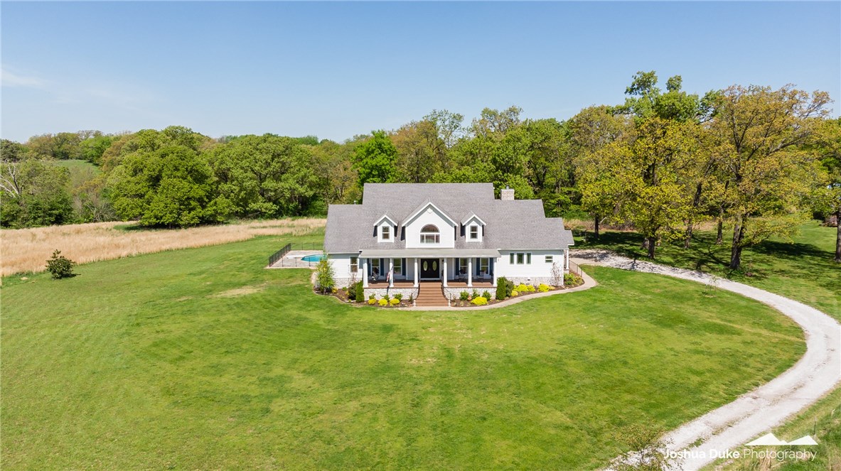 Are you looking for a one of a kind property with seclusion from the everyday world? Come home to this beauty that sits on 59.54AC. Relax on your front porch or sit on the back deck by the pool & hot tub. The home is 4724 sq.ft w/4BD, 4.5BA, office, formal dining, family room+living room, bonus room, hidden room in kids closet, library & 3 car garage w/electric car charging port. For the horse lover, this property has a 3000sq.ft barn w/ 3 stalls, tack room & workshop. Recently installed OzarksGo fiberoptic ethernet gig high speed internet. Major renovation in 2019 including new kitchen which features Fisher & Paykel, Thermador & BlueStar appliances, custom quartzite countertops & island, new laundry room, hardwood flooring on ground level, new carpeting upstairs, & paint throughout. HVAC system updated with 2 new units & both hot water heaters replaced. Barn area also features chicken coop, greenhouse, raised garden bed, treehouse & cross-fenced pasture for all varieties of farm animals, including an aviary!