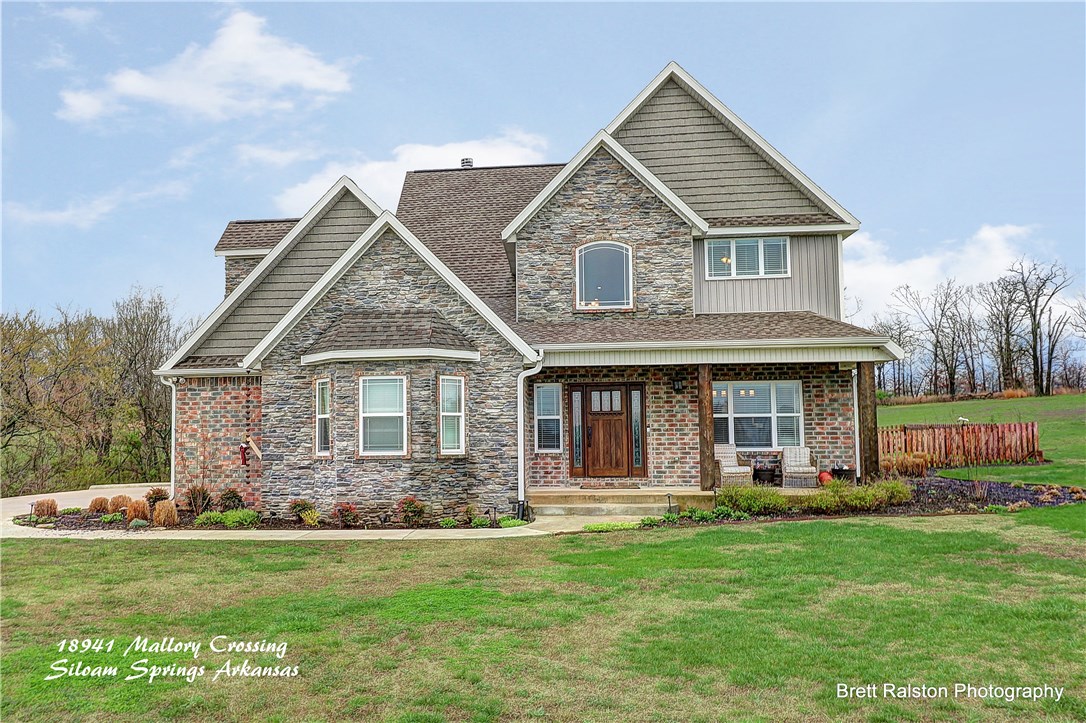 You'll love this charming, 2-story home nestled just inside the Siloam Springs School District. This 4 bedroom, 3.5 bathroom home with a 2-stall garage will give you 3,289 sq ft of generous space to move about and 4.4 acres of land for the kids to explore. Wake up each morning to awe-inspiring sunrises and beautiful secluded rolling hills, while still maintaining close proximity to the comforts of town. Situated in a friendly quiet neighborhood on the outskirts of Siloam Springs, just 25 min from Rogers.