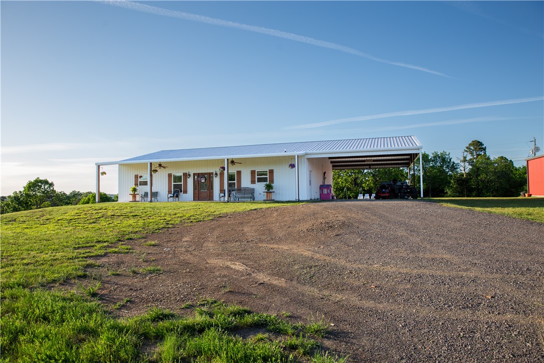 Barndominium meets modern farmhouse on 30+ breathtaking acres of Arkansas countryside! This open, light-filled home offers a thoughtfully designed open-concept layout perfect for both everyday living and entertaining, featuring 4 spacious bedrooms and 2 full baths. Step outside and embrace true lifestyle living hunt, fish, ride, farm, or simply relax in your own private retreat. Outdoor amenities are unmatched with a pond, 30x40 shop, oversized carport, and a resort-style in-ground pool. The ultimate setup for work, play, and unwinding under the stars. Secluded yet convenient, located approximately 20 minutes to Booneville and 45 minutes to Fort Smith.