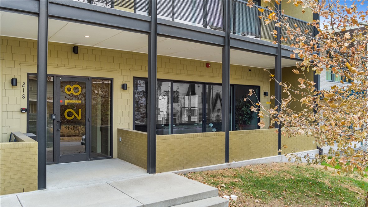 Rare opportunity to own a one-level, 2-bedroom, 2-bathroom condo with a detached 1-car garage just steps from Dickson Street and the Fayetteville Square! Built in 2019 by Mark Zweig, this open floor plan with 10-foot ceilings has updated finishes and amenities throughout. A wall of floor-to-ceiling sliding glass doors opens to the covered front porch on Church Avenue that is sure to be well utilized. When not in use, motorized custom shades provide privacy and convenience. The outdoor living is connected to the open kitchen, dining, and living space. A walk-in pantry and walk-in laundry room near the kitchen offer plentiful storage and functionality. Large bedrooms, each with their own ensuite bathrooms, include tall ceilings and custom fit Levelor window treatments. A private detached garage conveys with the unit - a luxury amenity amongst condos and townhomes downtown. If you've been looking for a high-end, low-maintenance, well-designed property in the Fayetteville entertainment and arts district, this is it!