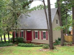Top quality updated custom built home with lots of character. Situated on a corner lot this Cape Cod style home features living room with wood burning fireplace. Formal dining off of kitchen. Kitchen has new gas stove and top of the line cabinets.  Nice walk in pantry. Master suite with walk in closet, double sinks, whirlpool tub, and separate shower. Upstairs features two bedrooms and Hollywood bath.  Two walk in attics located on second floor.  Another bedroom is located above garage.  Shop work area in garage.  Deck. Privacy fenced yard with Pergola with swings.