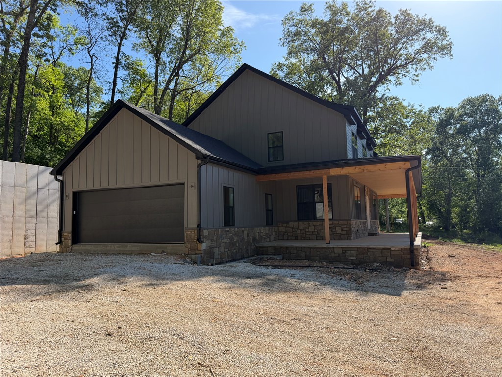 This beautiful new home built by PMI construction offers a wonderful blend of space, privacy, and modern comfort. With two thoughtfully designed stories, this 4 bedroom, 3.5 bath (plus an office) home provides room for everyone to spread out while still feeling warm and inviting.
The primary suite is conveniently located on the main level, with a well-appointed bath and a nearby half bath for guests. Upstairs, you’ll find three spacious bedrooms plus an office/bonus room. One of the upstairs bedrooms is oversized and could easily serve as another bonus room, media space, or playroom.
Start your mornings on the expansive front porch, perfectly sized for porch swings and slow coffee mornings, and unwind in the evenings enjoying peaceful views. Upstairs, a private rear deck offers direct access to the upper portion of the property — ideal for exploring, entertaining, or simply enjoying the extra space. Come see it!