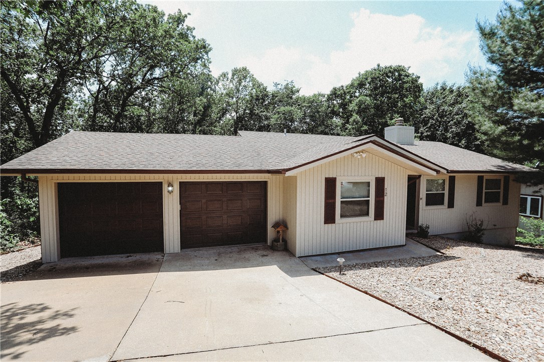 Close to town great location Bentonville Schools.  Spacious home on a private double lot backing up to wooded area.  Open floor plan featuring a 3 season/sun room, large family room/dining area, split floor plan, separate laundry room and a huge basement w/ double glass door overlooking the woods.   This could be an amazing bonus room! UV Air filtration system, Wired for a back up generator w/ generator pad outside.  Backs up to the back 40 bike trail.