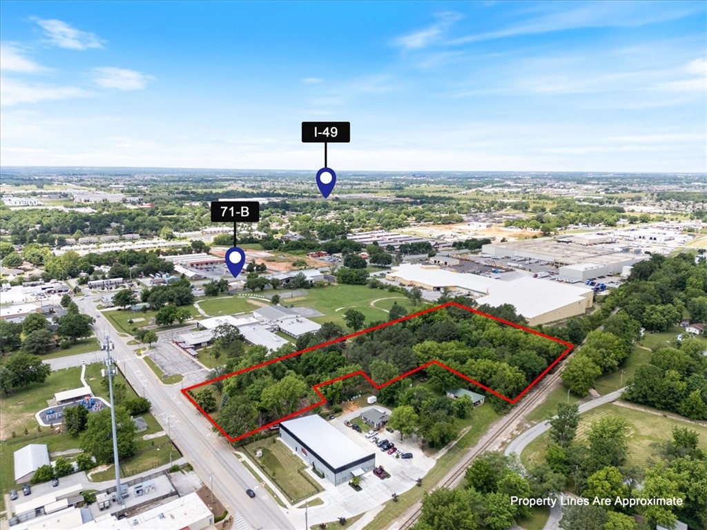 Water and sewer ON SITE!!! Positioned just off 71B on McClure Avenue in Lowell, this vacant 5.30 MOL acre lot offers unmatched development potential in one of Northwest Arkansas’ most central and fastest-growing areas. Zoned C2 per the City of Lowell, the property is ideal for a range of uses—including warehousing, storage units, or other investment-driven projects. The lot is ready for your vision, with the previous structures recently removed for a clean slate. Enjoy convenient access—just 7 minutes to I-49—making this a strategic hub for logistics, service-based businesses, or future commercial ventures. Don’t miss your chance to secure land in one of the most high-demand pockets of NWA.