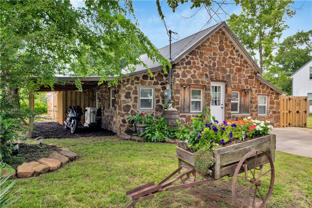 Welcome home to this “One of a Kind” HISTORICAL GIRAFFE HOUSE, fun, upbeat, open-concept 2 bed, 1 bath masterpiece located in the heart of Prairie Grove!  Completely updated and zoned for commercial & residential!  Walking access to all downtown & the parks. Historical and completely Brand New!  Entire lot is landscaped, with all new Plumbing, wiring, hot water heater, roofing, flooring, New outbuildings and attached carport.  Truly a one of a kind offering to be used as a home, office or an incredible investment, AirBnB your own Giraffe!