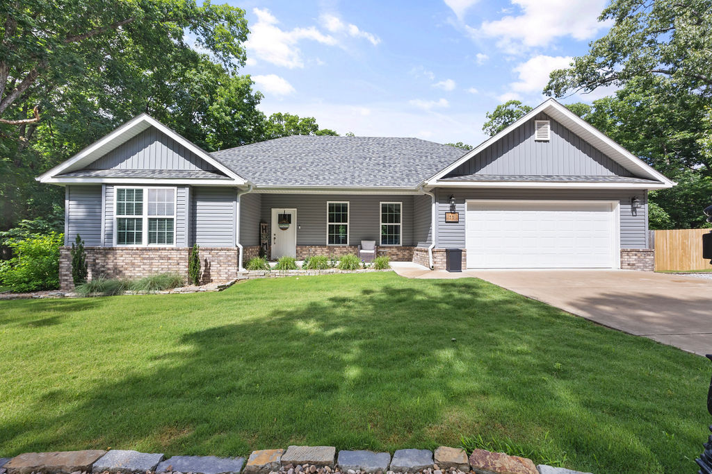 Tucked away on an oversized, beautifully landscaped 0.30-acre lot, this meticulously maintained home offers the perfect blend of comfort, convenience & adventure. Inside, you'll find 4 beds 2 baths, and a desirable split floor plan centered around an open living, dining, and kitchen space designed for gathering with family and friends. The kitchen pantry, abundant natural light, and seamless flow make everyday living easy. Outside, enjoy additional parking, three gated access points to the backyard, and thoughtful upgrades including gutter covers. For added peace of mind, sellers invested in additional foundation support backed by a lifetime transferable warranty. Adventure is never far away with a trail crossing just 0.25 miles from your door, the renowned Back 40 trail system only 1 mile away, and Lake Ann just 1.5 miles away. Enjoy access to Bella Vista's parks, pavilions, lakes, and endless recreational amenities—all while coming home to a property that has been lovingly cared for and thoughtfully improved.
