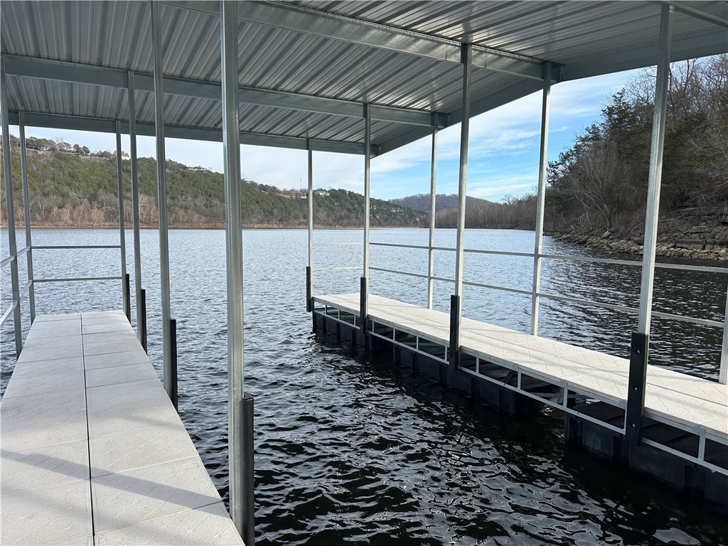 Once in a lifetime opportunity….457 acres of virtually untouched Lake/River front land on Table Rock/White River. Includes a new 30 ft. dock with Ultra Lite Decking. Located just steps from the quaint community of Beaver Arkansas with its historic little Golden Gate Bridge. Planning that spot for your dream estate home? This land offers both Lake Life and trolling up river for some great trout and walleye fishing. The property boasts over 1.75 miles of Table Rock lake front and contains Cedar Creek. Located in Carroll County, Arkansas and just minutes from the Mark Twain National Forest. There is an older home as well as a 3 car garage with living space above. With large hardwoods, beautiful cedar glades and amazing views of the lake, creek and mountains all located on a paved state highway 187, this property is restricted only by your dreams.