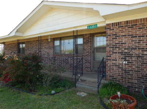 COUNTRY SOPHISTICATION! This beautiful brick Ranch style home features 3 oversize bedrooms 2 bathrooms, walk in closet, large laundry room, lots of kitchen cabinets, glass doors in the dinning area lead to covered deck.The gas heaters are just back up heat source to the Central Heat.  Two car garage plus Large Outbuilding. Municipal water plus a well. Many Fruit Trees. There is Fiber Optics running down the Highway.