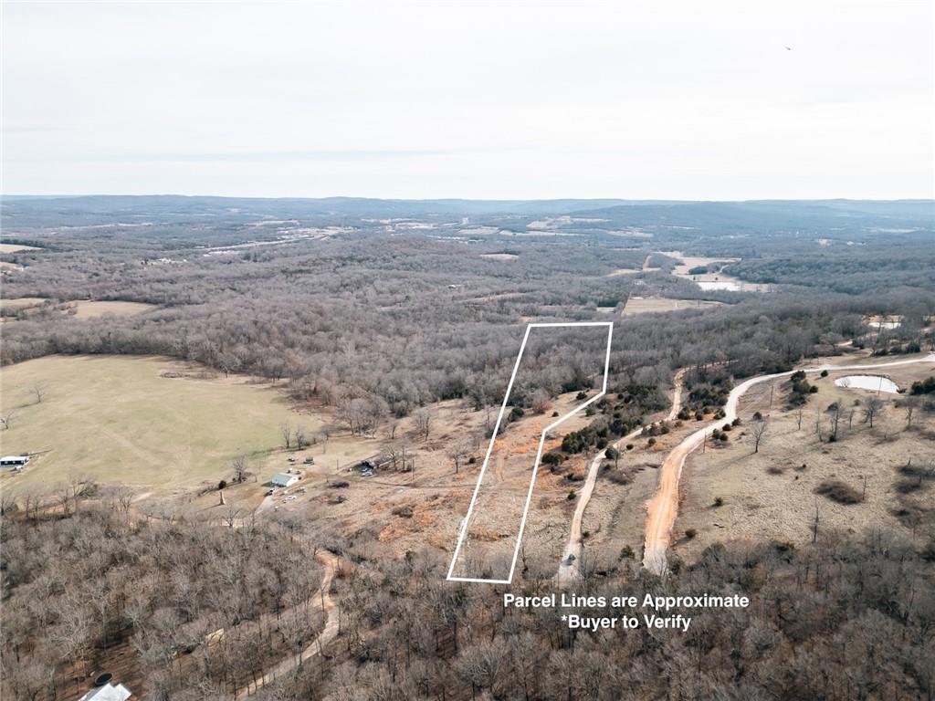 A rare opportunity to own 20 acres on Kessler Mountain Road, just a quarter mile from the trailhead at Kessler Mountain Park! This beautiful property offers breathtaking views of the Boston Mountains, providing the perfect backdrop for your dream home or a private retreat. Located just outside the Fayetteville city limits, this land offers the tranquility of nature while being only 10 minutes from downtown Fayetteville and the University of Arkansas. Whether you're looking to build a personal residence, multiple cabins, or an investment property, this location is hard to beat. City water will be available at the property once the water line is extended up the road.