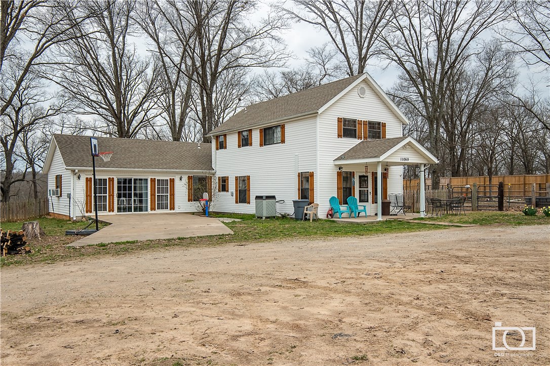 RARE FIND, A Mini Farm 2 miles from Walton Blvd with a lovely farm home on 3+ ac. Currently used as a horse farm giving lessons and birthday parties. Home has 2 large bedrooms and bath upstairs then living room, dinning, kitchen, laundry, bathroom, master and huge bonus room downstairs. Land is mostly flat, cross fenced with woven wire, with sanded ridding area. So much Potential; horses, goats, or a couple cows in town with all the conveniences.  Plow Mail Box does not Convey new box to be put up.