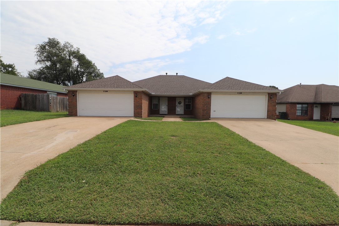 Secure an exceptional, low-maintenance income property in one of Fayetteville’s most high-demand rental corridors. Situated right off Wedington Drive, this 2,776+/- sq ft full-brick duplex offers immediate proximity to the University of Arkansas, local dining, and quick I-49 access. Each side features an identical, high-demand layout boasting 3 bedrooms, 2 bathrooms, and a private 2-car garage. It is the perfect setup for traditional landlording, student housing, or a house-hack buyer looking to live in one side while generating passive income next door.