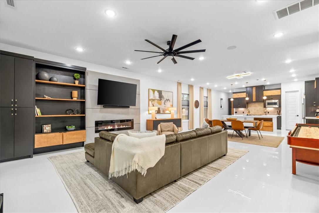 Welcome to the north side of Downtown Bentonville. From your front door, walk to Crystal Bridges, grab coffee at Airship, or bike to the Flyover Bridge & connect to the Greenway—giving you access to all of NWA. Designed to perfection! Being sold fully furnished. Currently operating as a STR. Kitchen features a 72” refrigerator, GE Cafe gas range, walk-in pantry, & built-ins. Each bedroom is generously sized & all have private en suite baths. The main-level bedroom opens directly to a private courtyard through sliding glass doors. Upstairs, the primary suite is beautifully appointed, while the third bedroom has its own private balcony. The secondary living area provides the perfect flex space for a media room or home office. The fenced side yard offers a functional space for pets or your garden. Detached 2-car garage w/ EV outlet & bike racks, storage shed, & attic storage. Perfect opportunity for a lock-and-leave in Downtown Bentonville or STR investment. Shows like a dream, a must see!