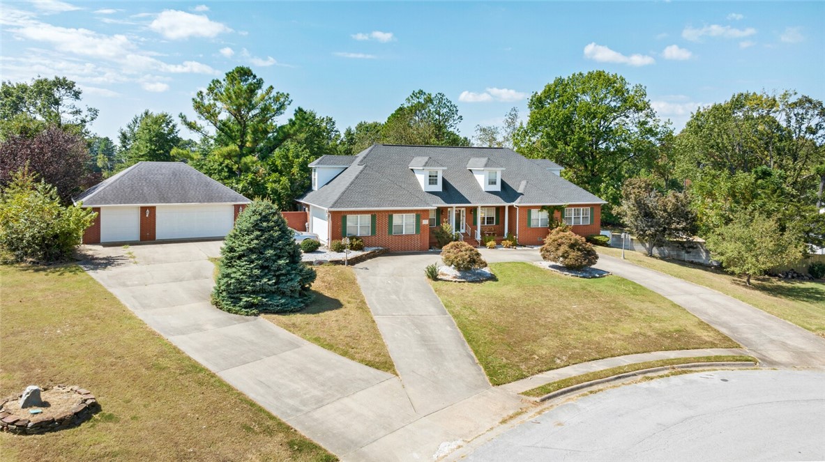 Rare opportunity to own 5 bedroom, 4.5 bathroom home with 5 car garage minutes from I-49, the promenade, the AMP, restaurants, Razorback Greenway Trail System, Rogers Aquatic Center, Schools, Hospitals & more! This 4,865 sq ft home features a great spacious layout featuring an office, formal Dining Room, large Living Room with fireplace & eat-in Kitchen & large pantry. Large Primary Bedroom two full bathrooms with individual large walk-in closets. One bathroom features a large vanity with sink, jetted bathtub, while the other full bathroom features a vanity with sink and walk-in shower. Enjoy large windows providing natural light, real hardwood flooring, built-ins, crown molding & abundant storage space. 3 bedrooms on the main level and upstairs enjoy 2 bedrooms with a full bathroom and game/bonus room. Private backyard offers a covered patio, inground vinyl liner pool, multiple sitting areas, green space and mature trees and landscaping, this home is perfect for entertaining!