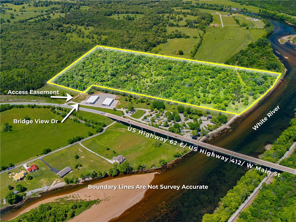 Discover a rare chance to acquire 62.92 acres of prime land along the scenic White River. This versatile property offers numerous possibilities for development or the creation of private estate. Conveniently located with easy access off Highway 62/412, just beyond the 62 bridge, this parcel has been professionally surveyed and is ready for your vision. Don’t miss this unique opportunity to invest in this beautiful location!