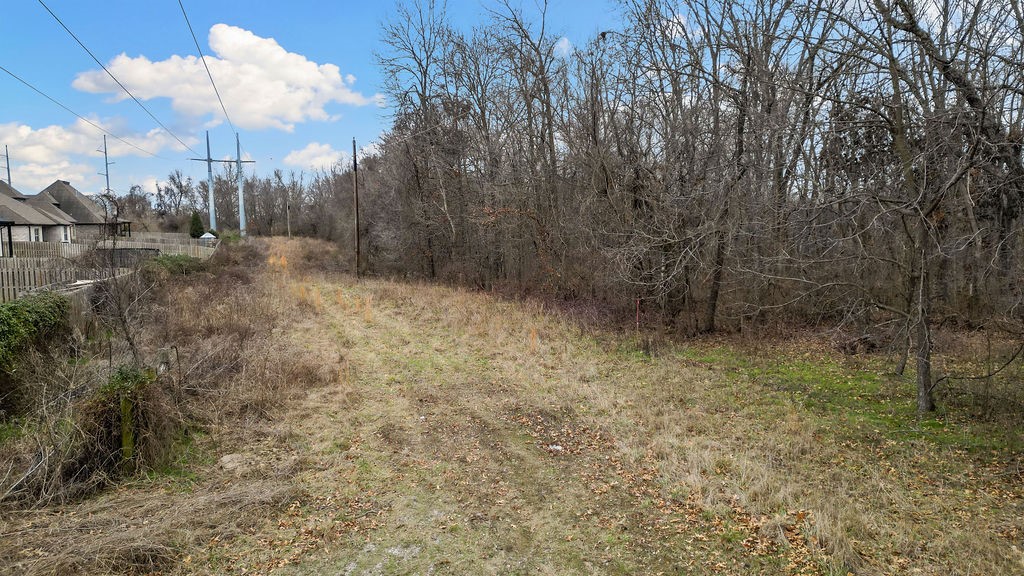 Nestled in a serene & sought-after area of Bentonville, this wooded lot offers 2.02 (+/-) acres of rolling, buildable land. Build your custom dream home on this lot with a walk out basement. Surrounded by mature trees, the property offers a peaceful and private atmosphere with a view of the hills in your backyard. This kind of gem is hard to come by—large, buildable lot like this is a rare find in Bentonville. Located just 0.6 miles from the nearby elementary & middle schools & only 1.5 miles from scenic hiking/mounting biking trails at Coler Creek, this lot offers easy access to ample outdoor recreation. The potential new McKissic Creek bike trail in the Bentonville Bike & Pedestrian Master Plan is located West of the lot. Whether you’re envisioning a private, luxurious retreat or a family home in the heart of a thriving community, don’t miss the chance to build your forever home in one of NWA's most sought-after spots! See Neighborhood association attachment for covenants and building guidelines