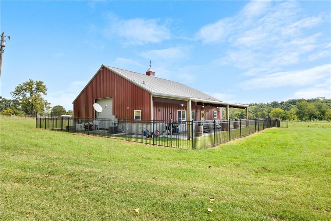 Investor Opportunity: Prime Subdivision Land in Bentonville Presenting a unique investment opportunity! This beautiful nearly 15-acre parcel of land is located right in Bentonville, offering the perfect blend of rural charm and modern convenience. Natural Setting: The property backs up to Osage Creek, providing a serene environment that's ideal for a country lifestyle. Ready for Use: Featuring a barn equipped with essential amenities and a functional barndominium that is ready to move in; with ample space for parking a full-size RV inside. It also features a full size generator. Agricultural Potential: Ample space for raising cattle, complemented by an industrial-sized freezer for efficient meat storage. Convenient Location: Experience the tranquility of country living while being just five minutes away from the nearest store. Don’t miss this opportunity to invest in a diverse and promising piece of land in a thriving community. For inquiries or to schedule a visit, please contact us!