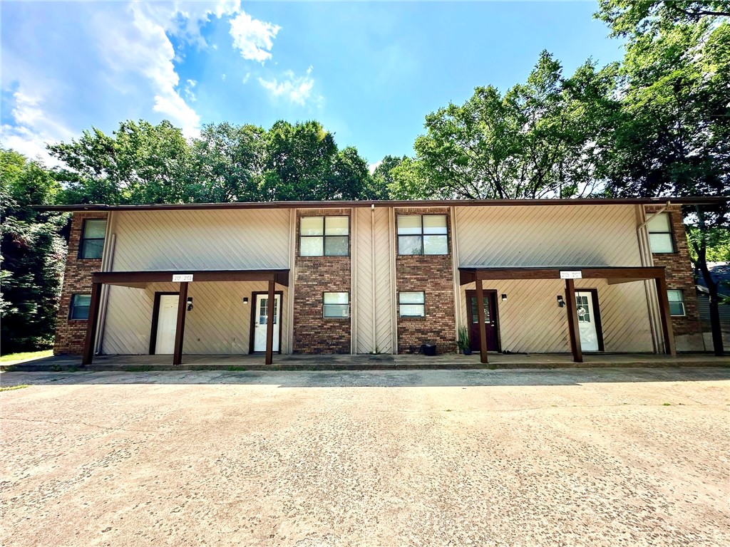 Calling all Investors! Just minutes from Gully Park and the Razorback Greenway trail, these 4 beautifully updated 2-bed, 1.5-bath townhomes are an exceptional investment opportunity! Nestled in East Fayetteville close to shopping and dining, and located only 3.3 miles from UofA campus and downtown, you'll enjoy quick access to
everything Fayetteville has to offer. These townhomes have been updated with a newer roof, flooring, paint, granite countertops, refinished cabinets, and lighting & plumbing fixtures throughout. The kitchen comes complete with newer appliances—including the refrigerator & washer/ dryer making this truly a turnkey investment. Listing is for all four single-family townhome units. *Please only show 2101 N East Oaks Dr, ML#1354514.* All 3 adjoining townhome units 2103, 2105, & 2107 N East Oaks Dr are tenant occupied and listed for sale separately, see ML# 1354516, 1354522, and 1354526 respectively. Please do not disturb tenants.