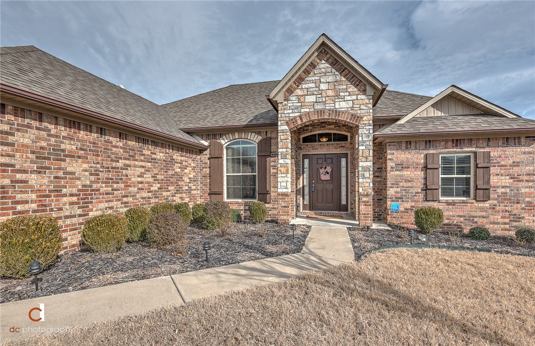 Must see beautiful home! Great location close to I-49 and 112. Only minutes from Pinnacle. Like new home! New modern paint through out. All new stainless steal stove, microwave, dishwasher and refrigerator. Granite countertops in kitchen and both bathrooms. Master bedroom has extra large walk in closet. Has one of the largest covered patios in the neighborhood with privacy drapes and nice cathedral cedar beams with access to the eat in kitchen and master bedroom. Like new grill and grill cover and a secondary patio and fire pit that conveys. Perfect for entertaining. Also equipped with outdoor gas grill hookup. You cant find all these extras anywhere else for this price. This one wont last long!