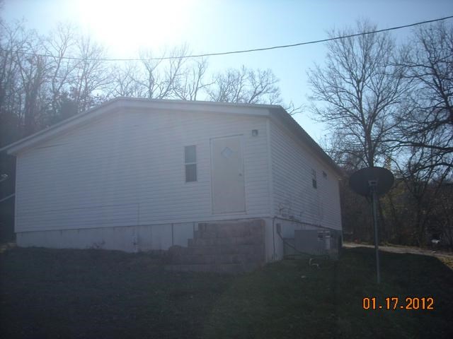 Nice double wide on large lot with shop building and springs on property.