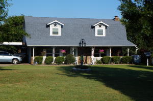 POSSIBLE OWNER FINACING ! Country charmer on 4ac.2 story barn-style home 3/2.5;new dbl pane tilt out windows; new Northern Maple flooring in lg open kit, dining & living; new counter tops, pull outs, walk-in pantry; gas f/p. All Bedrooms upstairs, master features walk out deck. 2car detached garage/shop, outdoor kitchen! 2gazebos; F/P.AGENTS PLEASE READ PRIVATE remarks