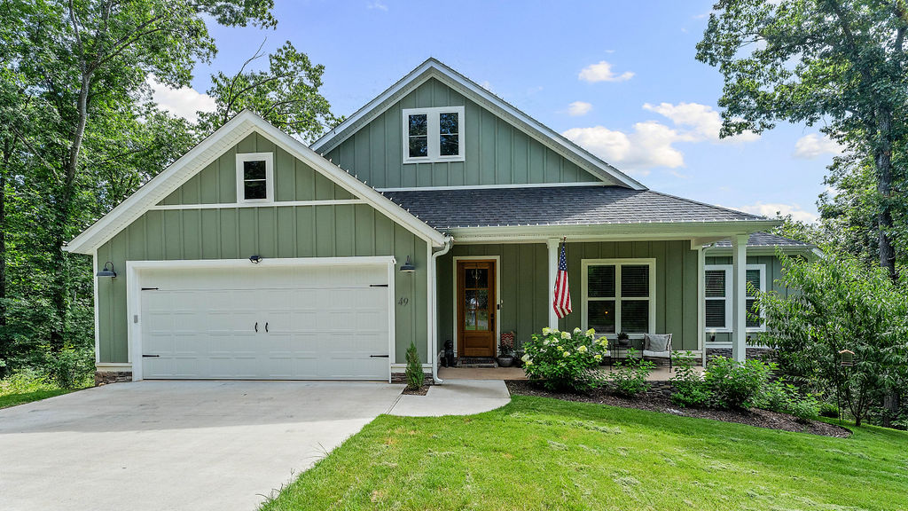 You've got to see this one! This clean, single-level home in Bella Vista's Jura neighborhood was built in 2024 and offers 3 beds, 2 baths, and 2,150 square feet, with gorgeous wood floors and a soaring cathedral ceiling throughout the main living space. The owners added custom cabinetry in the office, living room, and bathroom that completely elevates the space, plus a central vacuum system for effortless cleaning and a custom fence around the backyard for privacy. Cozy up by the gas fireplace on chilly nights, or take your coffee out to the covered patio, deck, and porch. The kitchen comes ready with a propane range, dishwasher, and microwave, and there's a 2-car garage for all your gear. Community perks include a pool, clubhouse, boat dock, and tennis courts, all just minutes from Highlands Golf Course and miles of walking and biking trails. This one's special!