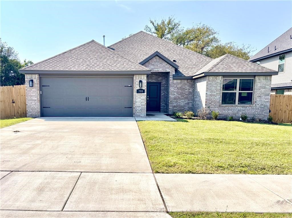 Brand new construction charming home featuring 3 spacious bedrooms and 2 full bathrooms and a fully fenced yard conveniently located. The living room includes a cozy fireplace and flows seamlessly into the dining area and kitchen, creating a perfect space for both relaxation and entertaining. The kitchen features  granite countertops, stainless steel appliances, and a pantry. Smart home features a ring doorbell and Google Nest Thermostat. The primary bathroom offers a fully tiled shower and a soaking tub. Each bedroom is equipped with generous walk-in closets, ensuring plenty of storage space. **NO PETS**