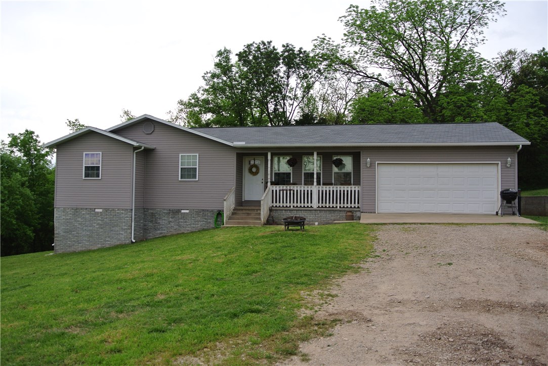 Such a Country Charmer, this home located just seconds from Berryville City limits has lots of character beginning with the 100 year old barn wood accent wall in living room, this 3 bed 2 bath home with lots of custom features. The garage has a large shop bench and laundry room. The 1.19 acres will be fenced off from the larger farms on either side. All Electric, has its own well and rural water on its way. All appliances and move in ready!