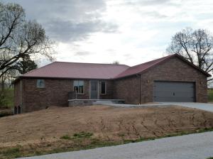 Gorgeous NEW CUSTOM HOME,fantastic location with view! 3 bedrooms + den,3 full baths, open floor plan, custom cabinets,4 CAR garage plus large room in basement would make a great game room/theatre room.Low maintenance exterior on nearly an acre lot.This new home is very high quality with beautiful upgraded finishes.Granite counters, walk in pantry, upgraded appliances.You will not be disappointed.