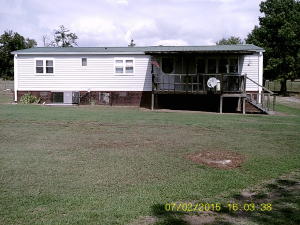 This is a very nice, fully remodeled mobile home. Home has bg rooms, open floor plan, large covers deck and parking area. Property includes 2septic and 2 water meters. Very clean property with room to grow!