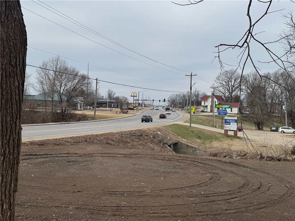 Large commercial tract in Farmington with appx 300 ft of Hwy 62 frontage in 2 parcels. Zoned commercial. Lots of options, very close to McDonald's, Sonic, Dollar Tree & First Security Bank. 36,000 traffic count. Must present a prof of funds letter with any offer