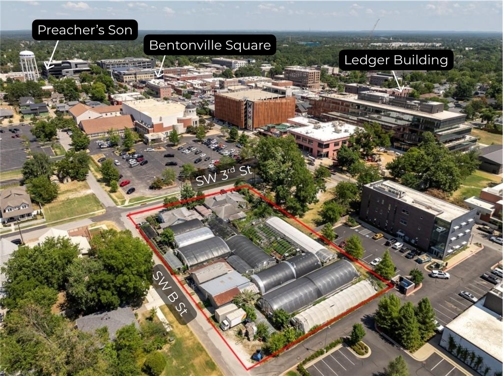 Commercial property located on a large 0.96-acre corner in the heart of Downtown Bentonville. Positioned near Skylight Cinema, the Ledger Building, and surrounded by the city’s thriving dining, entertainment, and retail scene, this property sits at the center of Bentonville’s continued growth. Featuring 123 feet of frontage along SW 3rd Street and 287 feet of frontage along SW B Street, it offers exceptional visibility and accessibility for future business or redevelopment opportunities. Currently operating as a flower shop and greenhouse, the site presents a unique chance to reimagine one of the most sought-after locations in Northwest Arkansas. Just 1.5 miles from the new Walmart Home Office and minutes from world-class mountain biking trails, this property combines prime location with endless commercial potential. Existing Greenhouse, and Flower shop business are NOT part of sale."