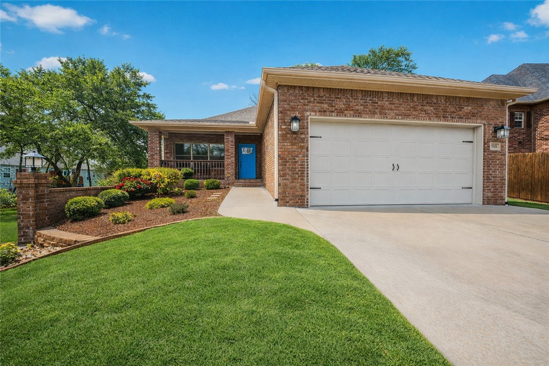 REDUCED to SELL! Location! — downtown Bentonville area, within walking distance to downtown and a short ride to Coler Bike Preserve. This home features a west-facing screened back porch. Inside, wood floors throughout the open-concept main level. The spacious living room connects to the EIK, creating an inviting layout. The kitchen feels like new and showcases beautiful custom cabinetry, quartz countertops, and a large walk-in pantry. The primary suite is located on the main level and includes a luxurious bath with a large tiled walk-in shower. A powder bath and spacious utility room complete the main level. The lower level offers versatility with two generously sized bedrooms, large closets, a full bath, and a large flex room perfect for a media, office, or gym. There is interior access from the main level as well as separate access from the garage — ideal for multi-generational living. A large mechanical room provides more storage options. Enjoy modern finishes and unbeatable proximity to everything Bentonville.
