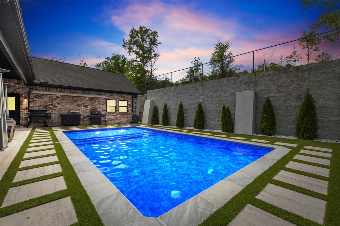 Private pickleball court and heated saltwater pool, hot tub and sauna, and conversational area firepit! Next door to Hand Cut Hollow at Grammercy Trailhead with access to the biking trails. Be the house where everyone wants to hang out and make memories! New turf and trees. New patio furniture that conveys. Downstairs theatre room with sofas that convey. Built ins in living room. Large walk in pantry and a dedicated "Everything room" with mudroom lockers, half bath and a double oven for your Sourdough Queen. New whole home water softening system. A two story climbing structure inside the home connecting floors (kids and adventurous adults love it.) A dreamy 3rd story kids nook- perfect for reading or hiding away. 3 ovens- one gas and two electric. 3 washer and dryer hook ups.