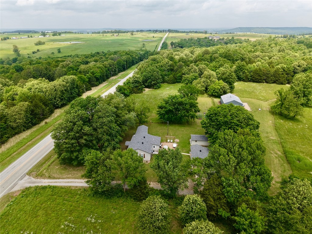Escape to your own private retreat on 50.78 m/l scenic acres, ideally located just 20 minutes from both Fayetteville and Huntsville. This thoughtfully restored 1951 home, remodeled in 2018, offers 1,152 heated square feet of comfortable modern living with timeless country charm.
This property includes several outbuildings. An insulated 30x40 shop, provision building with electricity, a detached garage, equipment storage, and pole barn.
Outdoor features include two large ponds, a year-round creek, two seasonal wet-weather creeks, garden space, and a fire pit area perfect for relaxing evenings under the stars. A 75-foot well with Bison pump, and three additional wells provide excellent water resources throughout the property. An RV pad with 50-amp hookup adds convenience for guests. 
Whether you are looking for a working homestead, recreational getaway, hobby farm, or peaceful country residence, this exceptional property offers privacy and beauty.