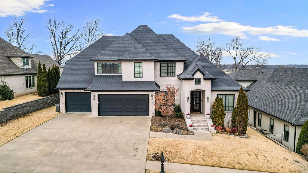 Set within the highly sought-after Shadow Valley community, this exceptional residence combines refined design with elevated comfort just moments from the clubhouse. Endless windows bathe the home in natural light, highlighting hardwood floors throughout both levels & custom built-ins that add character & function. The thoughtfully designed layout features both the primary suite & a secondary bedroom on the main level, while upstairs offers additional bedrooms—each with its own ensuite bath—plus a spacious bonus room. The 2025 renovated primary bath creates a true retreat with a jetted tub & steam shower featuring a Kohler Duet rainhead. At the heart of the home, the chef’s kitchen showcases KitchenAid appliances, double ovens, a 12-foot island, wine fridge, & walk-in pantry. Enjoy modern conveniences including surround sound throughout the home & back patio, EV charger, central vacuum & abundant storage. The covered back deck overlooks a beautiful valley backdrop & a spacious yard with plenty of room for a pool!