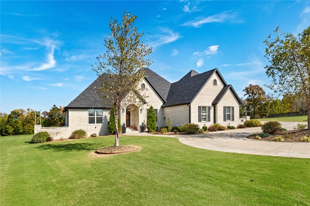 Must see gorgeous new listing tucked away at the end of a private cul-de-sac in one of Elm Springs’ most desirable gated communities, this beautiful 4-bedroom, 5-bath home offers the perfect blend of luxury, privacy, and everyday comfort. Set on 2.82 peaceful acres, the property feels like your own private retreat — complete with an in-ground pool, mature trees, and an expansive backyard ideal for entertaining or relaxing outdoors. Inside, you’ll find spacious open living areas, a modern kitchen with premium finishes, and large windows that flood the home with natural light. The layout features a primary suite oasis, a dedicated gym or flex space, and a bonus room perfect for movie nights, guests, or a home office. Every detail has been thoughtfully designed for function and flow and multiple living spaces. Enjoy the quiet of a gated, established neighborhood while still being just minutes from the conveniences of west Fayetteville, Springdale, and I-49. This home is a must see!