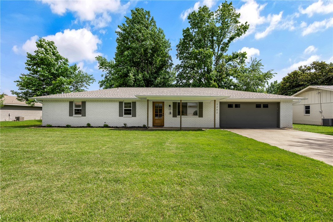 Walking distance to the new Walmart Home Office & Bentonville High School! A short bike ride to the charm of Bentonville Square, this beautifully renovated 3-bedroom, 2-bathroom home puts you at the center of everything that makes this city great. Inside, a recently remodeled kitchen welcomes you with modern finishes and newer appliances — ready for everything from weeknight dinners to weekend entertaining. The spacious primary suite is a true retreat, featuring a stunning tiled walk-in shower with a sleek frameless glass door. Step outside and you'll find a generously sized backyard with a newly built pergola — perfect for relaxing evenings or hosting friends, with plenty of room to add a pool. Easy access to I-49 makes commuting effortless, wherever the day takes you. All appliances convey. Don't miss this one — schedule your tour today.