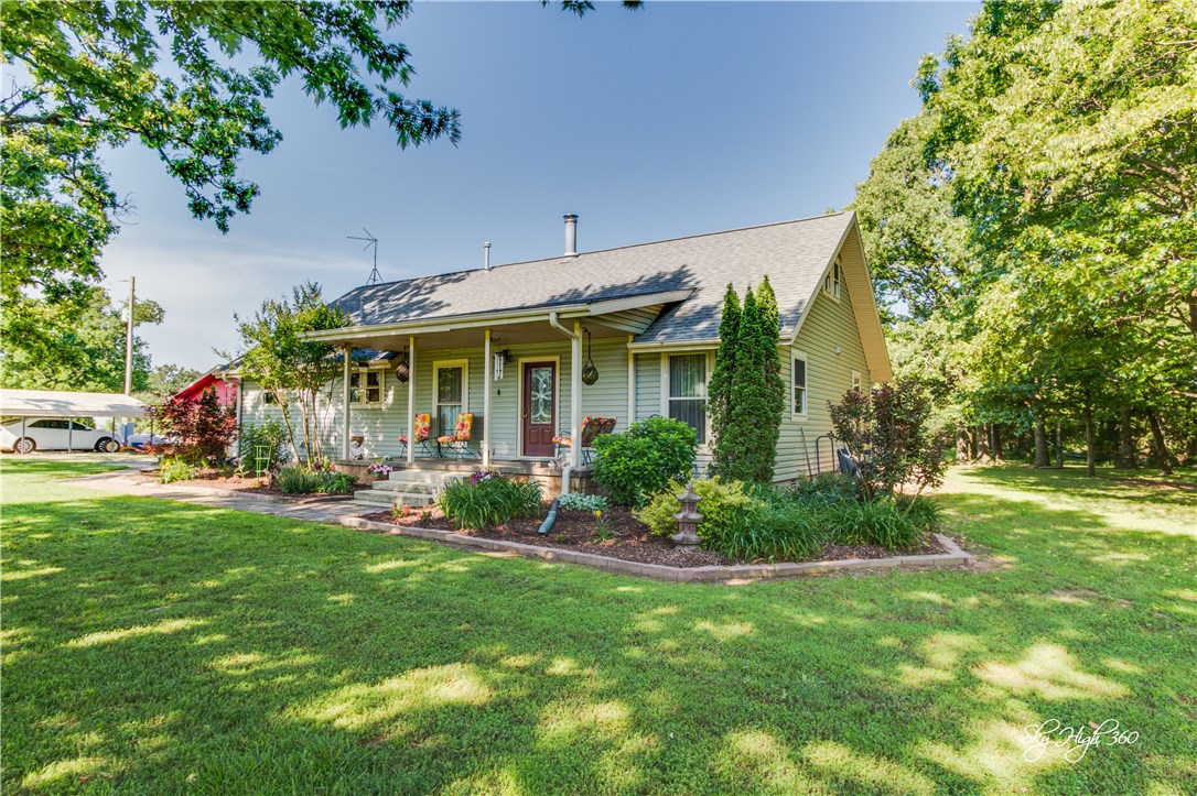 Your own piece of paradise on 20 acres! Quiet, peaceful setting with amazing sunsets. Country homestead with a ton of natural light with a pond, pasture and timber. Separate 2-car garage, double carport, 20x40 greenhouse, raised beds in the garden and a large pole-barn. Master bedroom and 2 other bedrooms on the main floor with 2 baths. Upstairs has another bedroom with a half bath and another bonus room. Come check out this private gem today!