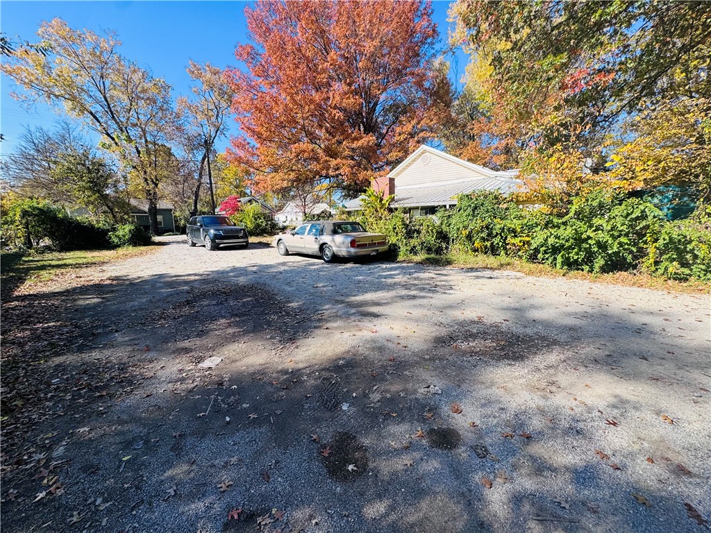 A great opportunity to own property in the highly sought-after South Fayetteville, this home sits on a large lot in a fast-growing area with strong long-term potential. Its location provides steady appreciation driven by ongoing University of Arkansas expansion and continued downtown development making this a strong investment choice. With easy access to I-49, Dickson Street, and the university corridor, the property is positioned near major growth zones and student housing demand, creating a reliable investment environment. The home is also close to parks and trail systems, adding lifestyle appeal for both residents and renters. Walking distance to the University of Arkansas and Baum Stadium further enhances its desirability for students, faculty, and game-day enthusiasts. This South Fayetteville location offers upward market momentum, making it a rare opportunity for an owner or investor seeking value and future return.