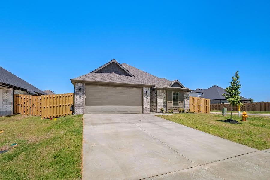 Experience the perfect blend of style and functionality in this perfectly situated home on a premier corner lot in the desirable Hunt Farms community. This 2026 build features a sought-after split floor plan that prioritizes both privacy and open-concept living.

The welcoming foyer leads to a light-filled Great Room that flows seamlessly into the dining area and a chef-ready kitchen—perfect for hosting. Premium finishes include elegant granite countertops, designer cabinetry, and durable LVP wood-look flooring throughout the main living areas. The private primary suite is tucked away from the guest bedrooms for maximum solitude and features a spacious walk-in closet.

Complete with a fully finished 2-car garage, convenient laundry hookups ready for your preferred appliances, energy-efficient construction, and a charming covered front porch, this home offers modern convenience just minutes from the I-49 corridor, Pinnacle Hills, and the Razorback Greenway. Move-in ready and designed for the NWA lifestyle!