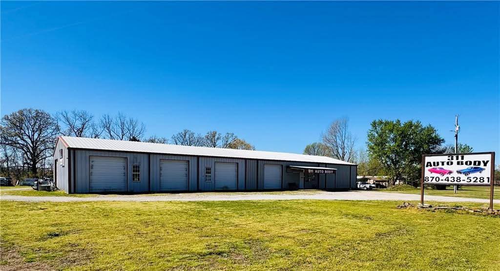 Established commercial opportunity on 6 acres with excellent visibility and access along Hwy 311 near Green Forest. This property features the well-known 311 Auto Body shop, a large shop building with ample workspace, and a mobile home currently located on the property. The acreage provides room for equipment storage, parking, expansion, or a variety of business and investment uses. Whether you're looking to continue an automotive-related operation or adapt the property for another venture, this property offers flexibility and potential. This tract is part of a larger property division. See MLS #1341866, MLS #1341870, and MLS #1349276 for related listings and additional purchase opportunities. Acreage, improvements, measurements, and intended uses to be verified by buyer.