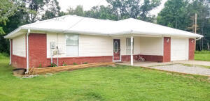 OPEN FLOOR PLAN!  This home is a spacious 3BD 2BA home at the end of the road. Property includes three lots making up 1 Acre M/L of property and includes a 41X32 shop with electric. Home has a BRAND NEW METAL ROOF & all new flooring, and paint. Water heater was replaced in May of 2020 and new 3 Ton HVAC unit  installed in April of 2020. Owners are also offering a 1 Year Home warranty for buyers peace of mind! Schedule your showing today!