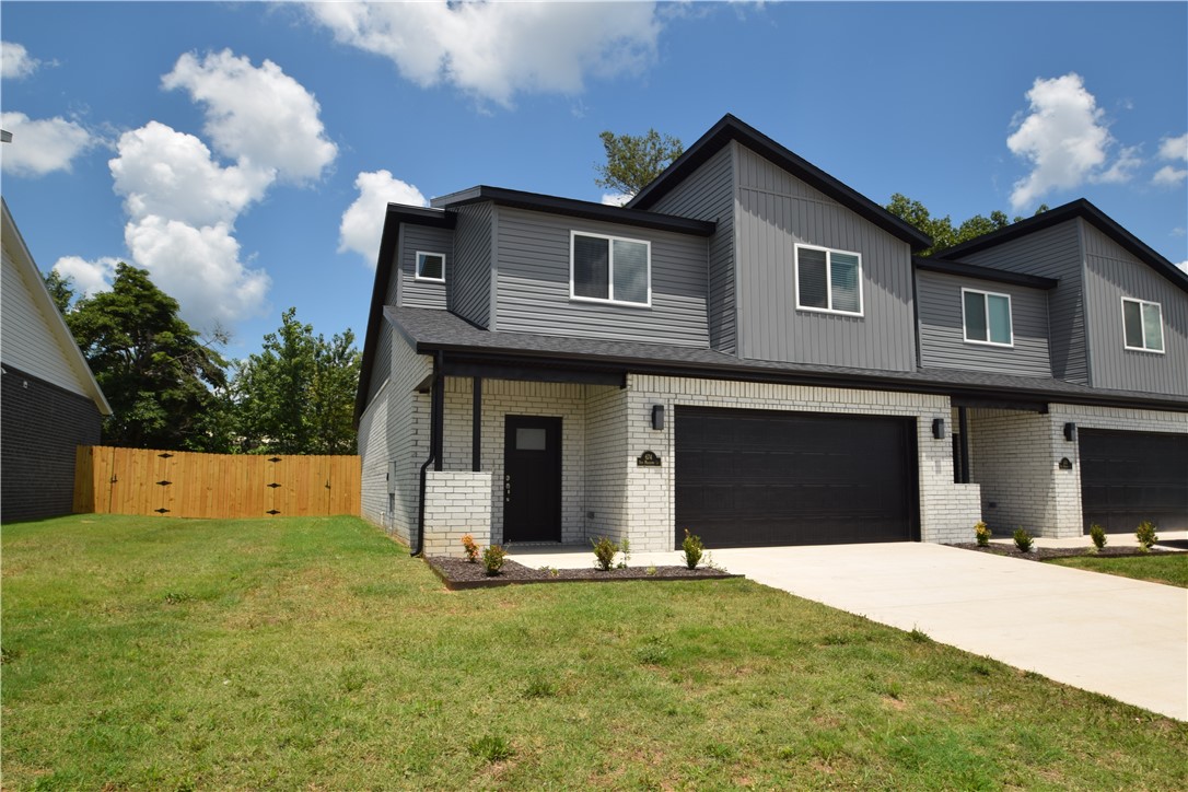 Welcome home to this brand new modern design! Perfectly located just minutes from top-rated schools, shopping, McKissic Springs Park, and Corner Woods Park. Outdoor enthusiasts will also love being a short 6-minute drive from the world-class Coler Mountain Bike Preserve and close to everything downtown Bentonville has to offer. The bright main floor features beautiful wood-look tile, soaring ceilings, and a spacious open-concept living area flooded with natural light. You will love the kitchen's premium granite countertops, stainless steel appliances, gas range, and large walk-in pantry, as well as the convenience of the main-floor primary suite with its own walk-in closet. Upstairs offers two additional bedrooms, a full bath, a versatile landing space for an office or play area, and extra attic storage. Move-in ready with 2" faux wood blinds, the home is complete with a private back patio and a large yard fully enclosed by a wood privacy fence. Contact our preferred Lender to explore lender credits & options!