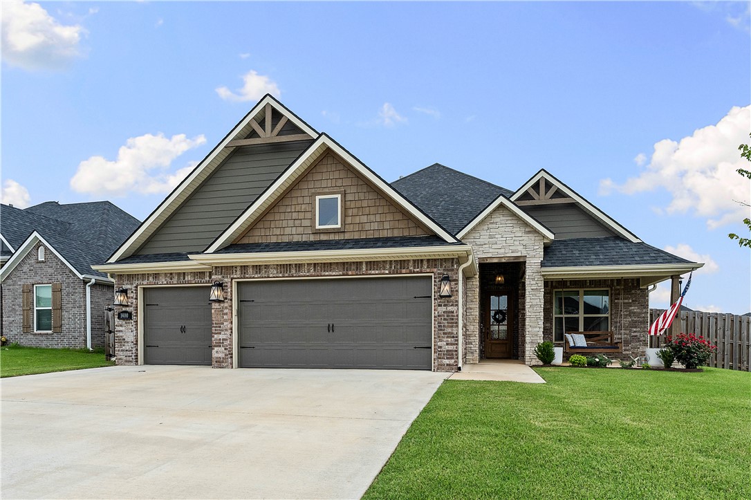 Welcome to this beautiful home in Diamond Estates, situated on a spacious corner lot. Featuring a 3-car garage, storm shelter, and charming front porch swing, this home offers both comfort and convenience. The main level includes a spacious primary suite and a second bedroom with a murphy bed, while upstairs you’ll find two additional bedrooms connected by a Jack-and-Jill bathroom. The open-concept kitchen and living area showcase stained wood beams, granite countertops, engineered hardwood floors, abundant storage, a built-in desk/bar area, designated mudroom area, and stylish shiplap accents throughout. Step outside to a level backyard complete with an outdoor fireplace and playground that conveys. Located within walking distance of Bentonville West High School, residents also enjoy access to a neighborhood pool, clubhouse, and nearby walking and biking trails. Offering the perfect combination of space, style, and location, this home is a must-see!