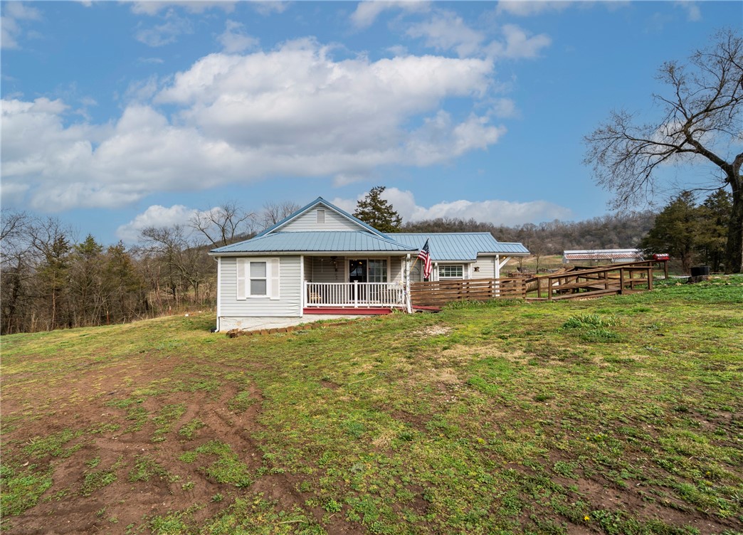Rural 3/2 on .72 unrestricted acreage, chickens farm friends allowed, easy access to I-49 N/S within 10 minutes. New living room & dining room stud flooring a porcelain tile LR/DR/MBR; new sheetrock MBR/LR/DR bathroom & recently painted.  New dual heat/AC unit install 2019, new propane water heater install 2025; private well and septic certified service records; partially landscaped.  Enjoy relaxing on the bluff, view the Chalebyte River below in a bucolic setting, a 360 degree view without multiple neighbors.  Occupied, do not disturb tenant. This is a fantastic well maintained starter home for a family wishing rural life and unrestricted privacy.