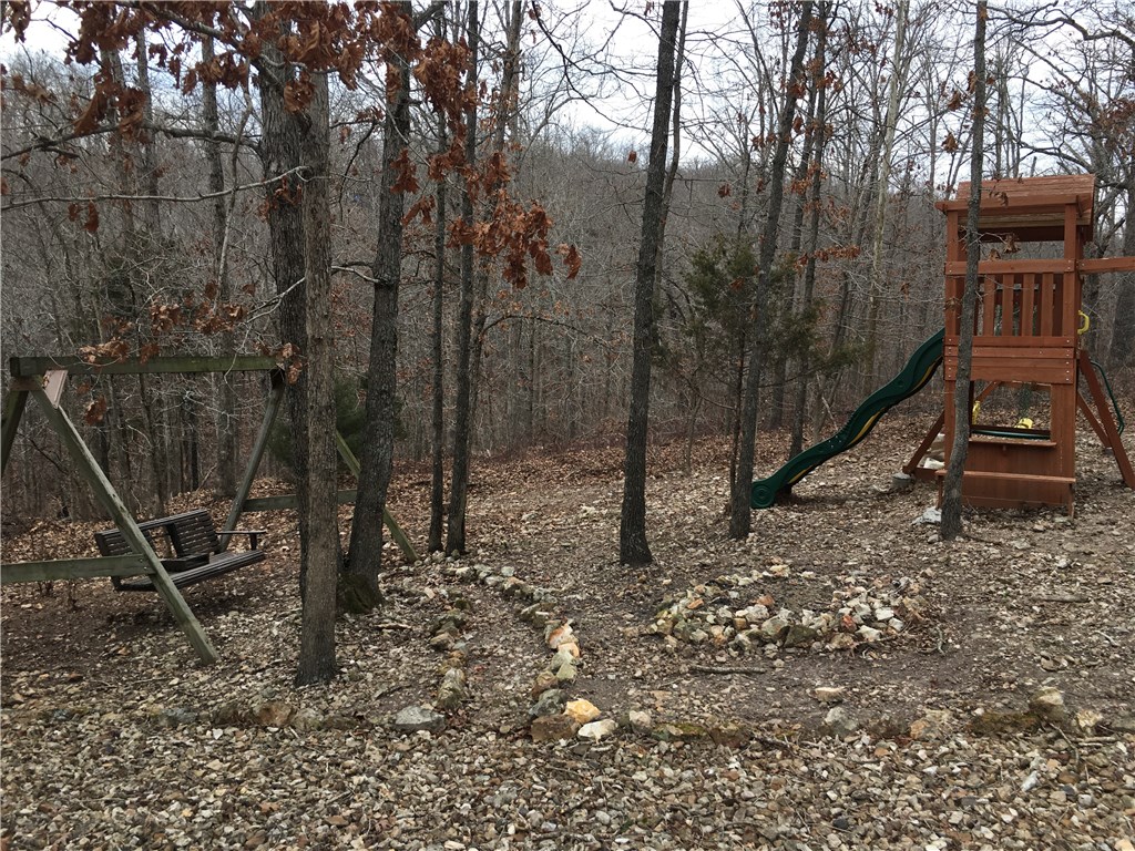 Close to Lake Loch Lomond, shopping & 71 business.  Playground equipment and swing convey with lot sale.